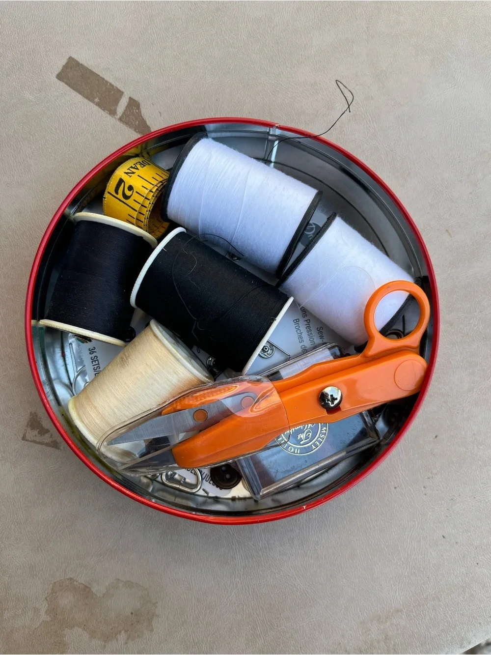 Orange Sewing Scissors with Assorted Black, White, & Cream Threads in Floral Tin
